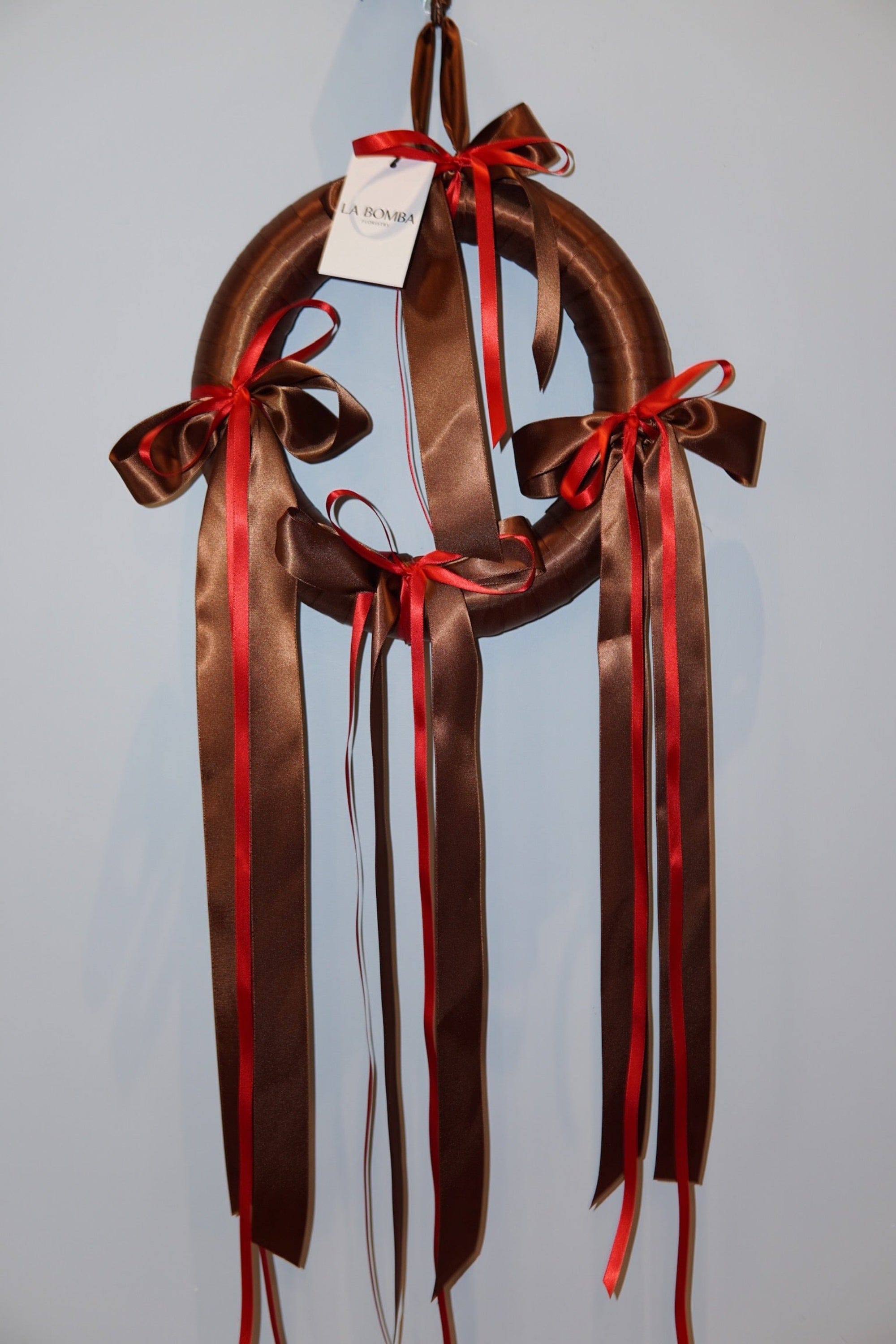 La Bomba Floristry Flowers Holiday Ribbon Wreath - Chocolate/ Red 12.5" La Bomba Floristry Vancouver Canada Holiday Ribbon Wreath - Chocolate/ Red 12.5"
